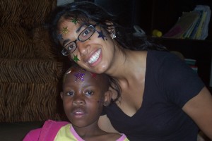 Supriya takes a picture with a local child in Tanzania