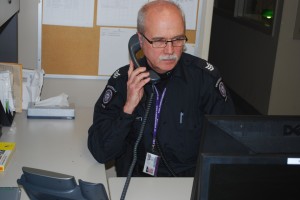 Acting Sgt. Scott Hessel of Western’s Campus Community Police Service sits in the police office in Lawson Hall at about 1 a.m. on March 1   Photo by Ben Forrest