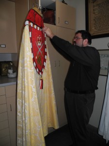 Bill Cliff inspects robes