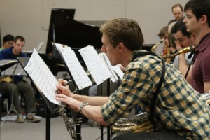 Saxophonist David Stewart edits to his sheet music during jazz practice.