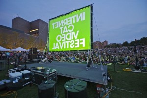 Thousands of fans watch a selection of cat videos at the Internet Cat Video Festival in Minneapolis last summer. <br/> <small> Photo courtesy of the Walker Art Center. </small>