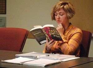 Meg Pirie, a facilitator for the Grit Uplifted writing group, reads from Zadie Smith's book On Beauty during a writing lesson