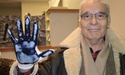 Oil battle rallies Canadian-Ecuadorian community A Canadian man displays his oil-covered glove used in the Dirty Hand Campaign against Chevron.
<br /> Photo courtesy of the Committee in Solidarity with the Indigenous People of Ecuador Affected by Chevron <br />