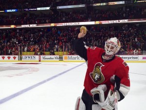 Sens goalie Andrew Hammond skates off with a burger after a recent victory.