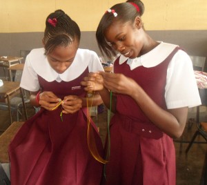 CHANCES provides basic school necessities to children in Jamaica like these two young girls in art class.  Photo courtesy of D’Lenney Grant.