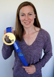 Jayna Hefford holding her 2014 Gold Medal