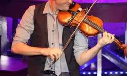 Jesse Grandmont plays violins with bands as his usual gig.