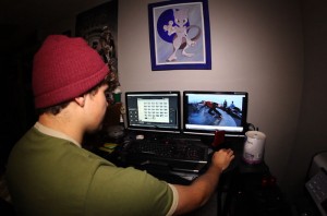  Groves editing some past clips. He says this improvement in everyday technology has given urban snowboarding a major boost. Photo courtesy of Jordan Groves. 