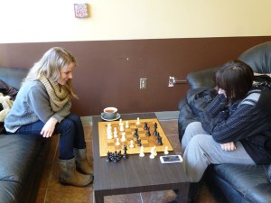 Jenny Mayer and Jessica Cooper come to board game cafés for an experience that differs from a bar or coffee shop. Photo courtesy of Allan McKee